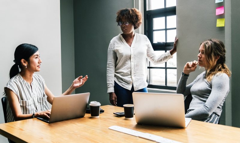 women brainstorming in conference room