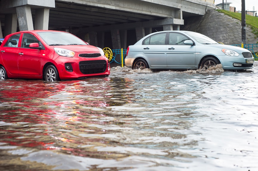 cars in flood under overpass