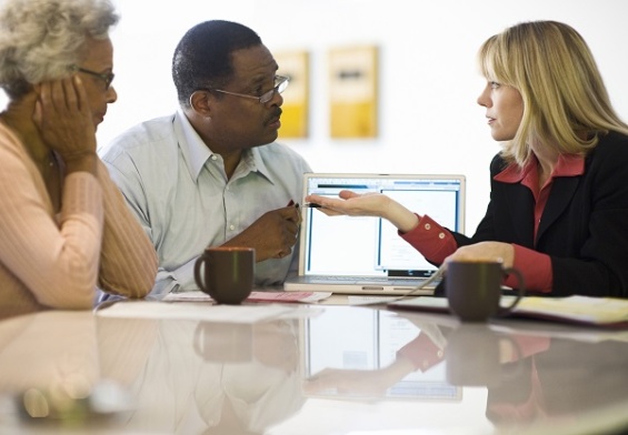 Financial advisor with couple at home