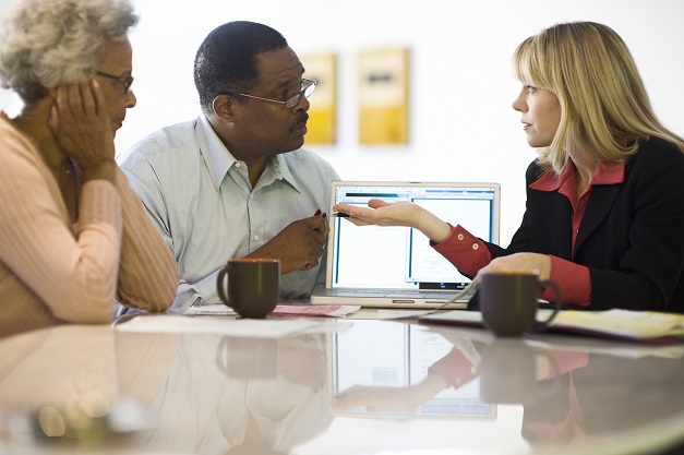 Financial advisor with couple at home