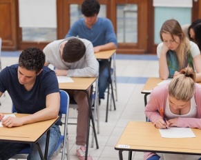 students sitting a test in exam hall