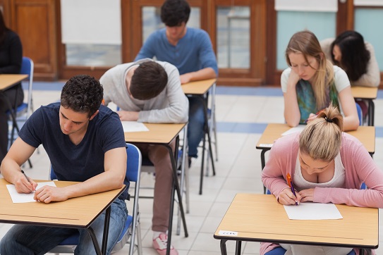 students sitting a test in exam hall