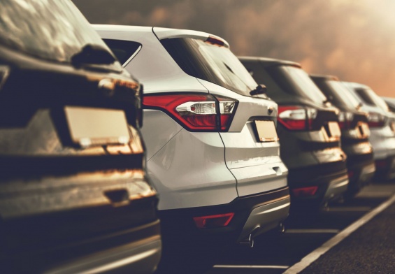 rental cars lined up in a parking lot